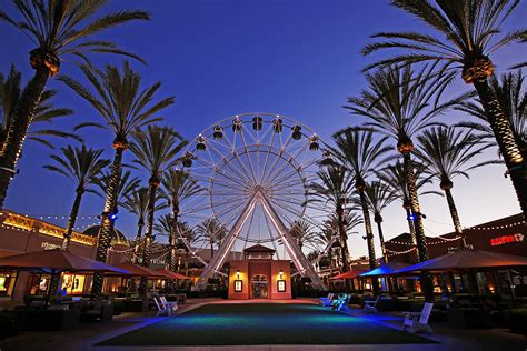 Irvine spectrum center. Irvine Spectrum Center With a Ferris wheel and Spanish ambience, this shopping center expands the definition of “mall” Southern California is known for its sunny, open-air shopping centers, but this outdoor mall in the heart of Orange County ups the ante with carnival-style rides, pop-up eateries, and unexpected shops. 