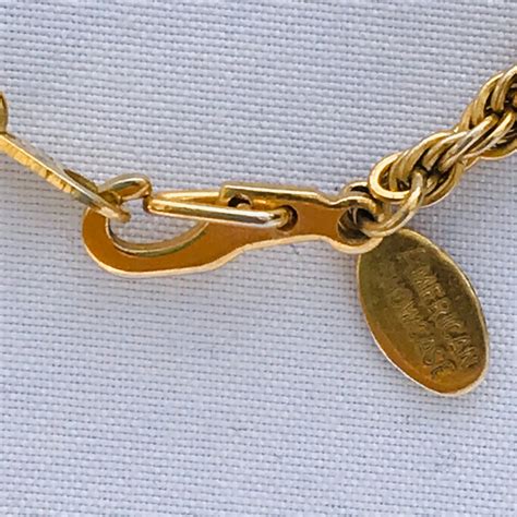 American Showcase Gold Tone Rope Bracelet 1990s Vintage Jewelry An elegant bracelet with a designer name tag AMERICAN SHOWCASE. In good vintage condition Credit card payments can be made by choosing the Paypal Option at the checkout and then signing is as a guest (link is at bottom of. 