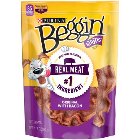 Let your dog Savor the slow-cooked taste of Purina Beggin' Strips Thick-Cut Hickory Smoke Flavor adult dog snacks. This recipe features real bacon along with real meat as the #1 ingredient, giving your dog a mighty, meaty snack he can happily nibble on. The tempting texture makes each strip easy for him to chew, and these strips can be torn into smaller pieces for bite-sized bits of yum.. 