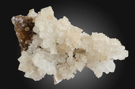 Halite, better known as salt, is so commonplace it's easy to forget halite is a collectible mineral with its perfectly formed, sharp-edged cubic crystals. Its hygroscopicity and distinctive taste set it apart from all other minerals and account for its great economic importance and prominent role in history..