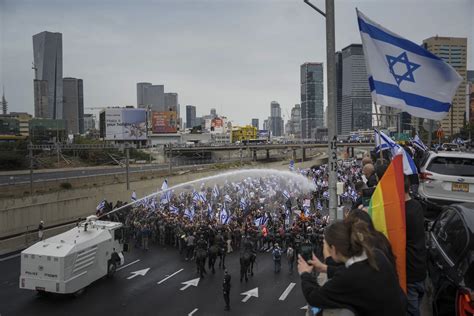 Israel passes law protecting Netanyahu as protests continue