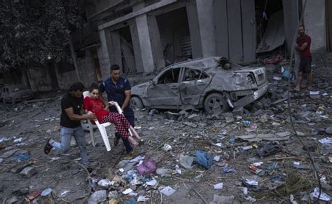 Israel strikes neighborhood after neighborhood in sealed-off Gaza as war appears set to escalate