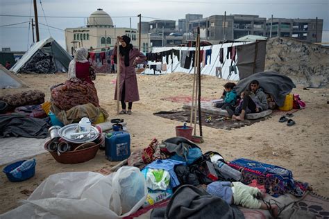 Israel urges Gaza civilians to flee to ‘safe zone,’ where arrivals find little but muddy roads