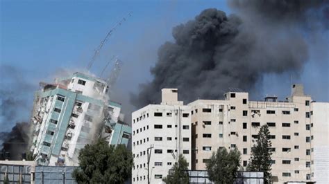 Israeli airstrike flattens a high-rise building in central Gaza City after Hamas' surprise attack