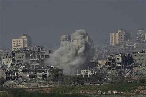 Israeli airstrikes level apartments in Gaza refugee camp, as ground troops battle Hamas