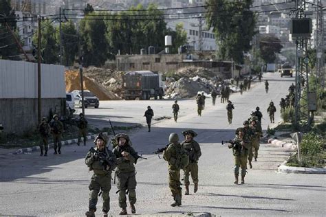 Israeli forces kill at least 8 Palestinians in surging West Bank violence, health officials say