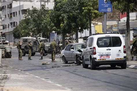 Israeli police kill Palestinian teen assailant after stabbing. Israelis hurt in West Bank bombing