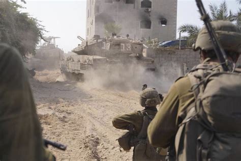 Israeli troops surround Gaza City. Communications being restored to territory