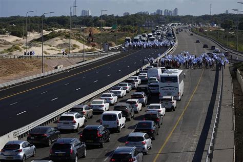 Israelis block highways and throng airport in protest at government’s plan to overhaul the judiciary