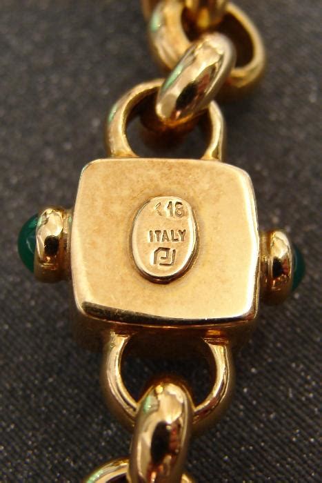 Gold Ring. The 18K Italian Art Nouveau ring pictured above seems to have been made between 1934 and 1944, the period of the fasces symbol for Italy. To the left of the fasces, there appears to be a number 7, a number 1, or perhaps even a hammer or ax. I believe this symbol to be the identifying mark of the maker..
