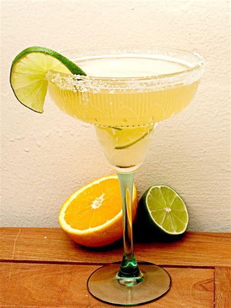 Italian margarita olive garden. directions. Moisten the rim of a margarita glass and dip it in green sugar crystals. Or skip this step if you prefer. Fill the glass with ice. Add tequila, triple sec, and … 