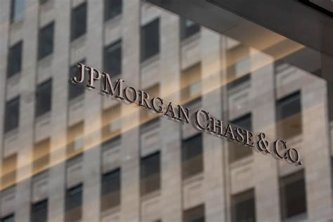 JPMorgan Chase, KBR rise; Global Payments, Exxon Mobil fall