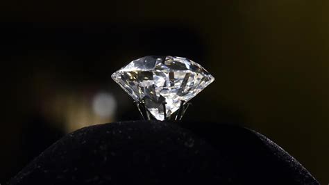 The diamond has a rectangular cushion cut with 58 facets and