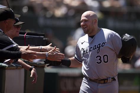 Jake Burger homers, White Sox hold off A’s 8-7 to avoid a sweep