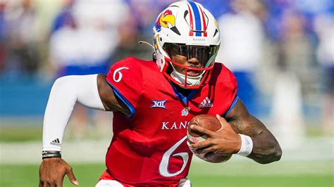 RENO, Nev. (AP) — Devin Neal and Daniel Hishaw Jr. combined for 137 rushing yards and four touchdowns, Jalon Daniels threw for 298 yards, and Kansas pulled away from Nevada. 