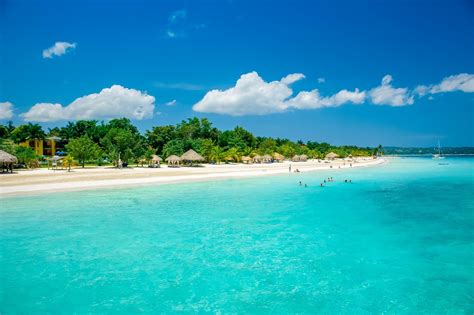 Jamaican beach. Take a relaxing stroll down the world famous 7 Mile Beach in Negril, Jamaica.Featuring a mix of Resorts, Hotels, Villas, Cottages, Bars, and Restaurants, the... 