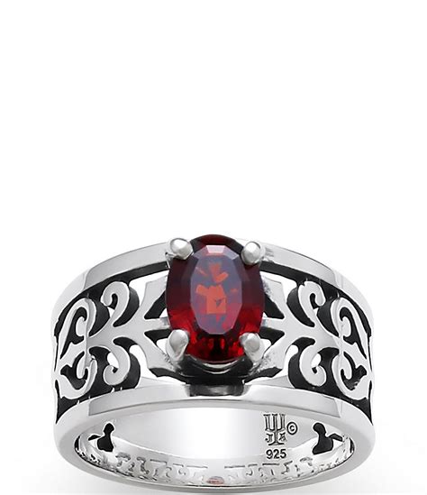James Avery Wedding Ring Set - 18 Karat Yellow Gold, Sterling Silver, Garnet This gorgeous wedding ring set comes from Texas-based family owned and operated jeweler, James Avery, known for creating finely crafted, timeless pieces that reflect everyday life's important elements.. 