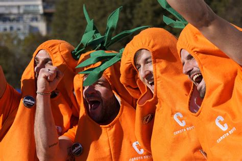 Jannik Sinner’s carrot-clad fans take root on the tennis tour in their orange-colored costumes