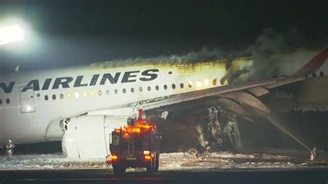 Japan Airlines jet bursts into flames after landing at Tokyo Haneda airport, all passengers evacuated: NHK