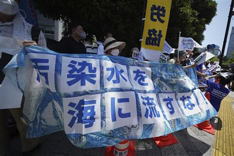 Japan defends neutrality of IAEA report on Fukushima water release plan as minister visits plant