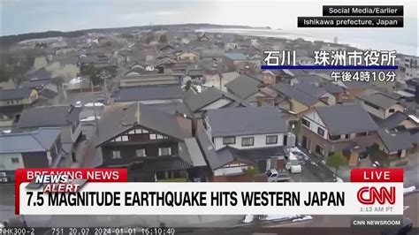 Japan lowers its tsunami warning but still tells people not to go home after a series of earthquakes