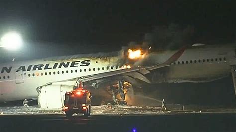 Japanese TV reports a plane has caught fire on the runway of Tokyo’s Haneda airport