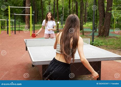 Japanese girl playing ping pong.  Between the two being compared here,...