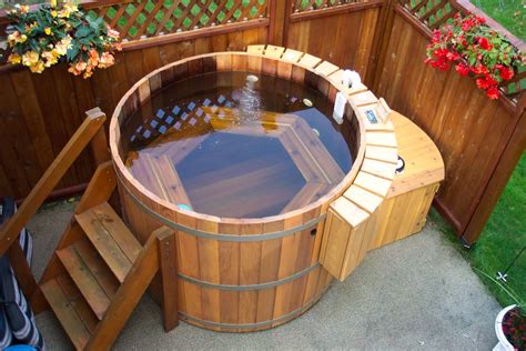 Japanese soaking tub outdoor. 35" diameter by 30" tall by 68" long Seats 2. This one of a kind, Japanese 2 person soaking hot tub, is the most beautiful hot tub experience you will ever find. The natural look of 100% beautiful western red cedar will make this hot tub the focal point of any back yard or cottage setting. This extra deep soaking tub provides the same relaxing ... 
