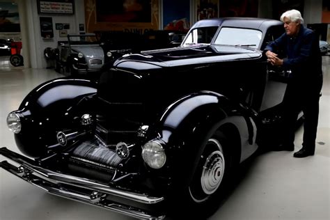Jay Leno's garage is a car lover's dream, with a collection of 185 cars and 160 motorcycles. From a 1928 Bugatti Type 37A to a 2010 Koenigsegg CCXR Trevita, his collection features iconic and rare .... 