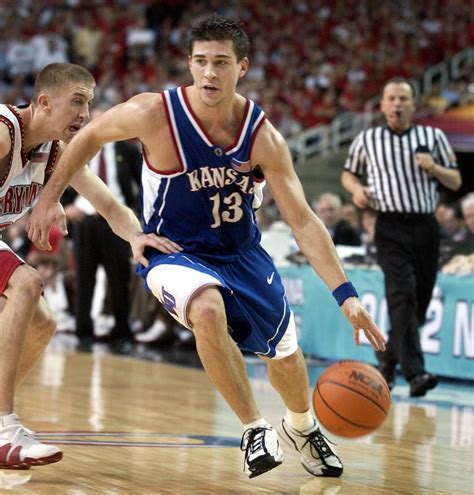 Kansan file photo Jeff Boschee, who played guard for Kansas, shoots a jump shot in a game against Iowa State during the 2001-2002 season. Boschee was renowned as a sharpshooter. 