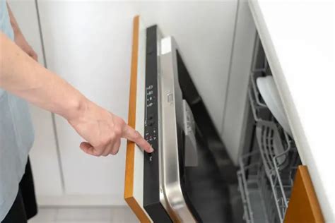  1. Open the dishwasher and remove the two plastic grommets about halfway down on either side of the opening. Then remove the two screws under the grommets. 2. Remove the kick plate under the door. May have to lower unit by turning the feet using the adjustable wrench. . 
