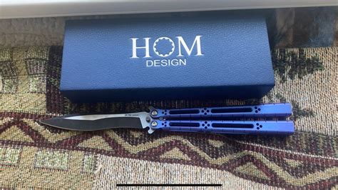 Frame/Liner: Titanium. Weight: 4.67 oz. Knife Type: Butterfly. Brand: Hom Design. Model: Basilisk-R. Country of Origin: USA. Best Use: Recreation. Product Type: Knife. Blade HQ is proud to bring you the Standard Issue Basilisk-R from Hom Design with green, natural G-10 handles and skeletonized titanium liners.