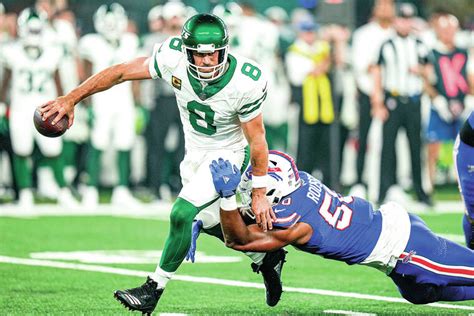 Jets lose Aaron Rodgers to an Achilles tendon injury, then rally to stun Bills 22-16 in overtime