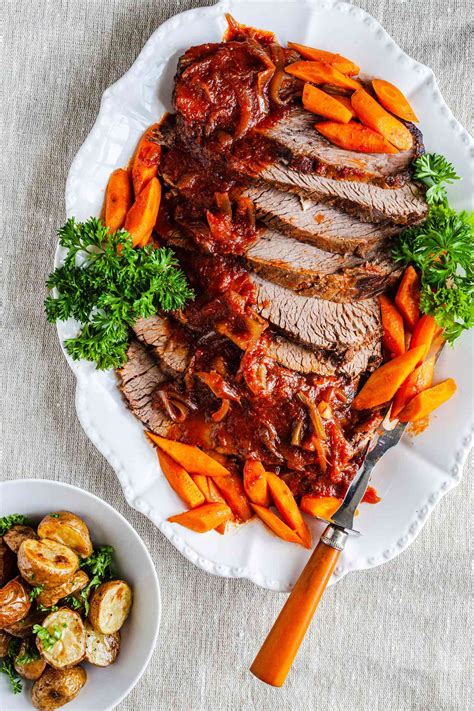 Jewish brisket recipe. After marinating the brisket in a combination of onion, garlic, red wine, oil, honey, cola, and ketchup, cook it in a slow cooker for 10 to 12 hours. Consumer Hotline (212) 613-8241x3 | New Company Hotline (212) 613-8372 