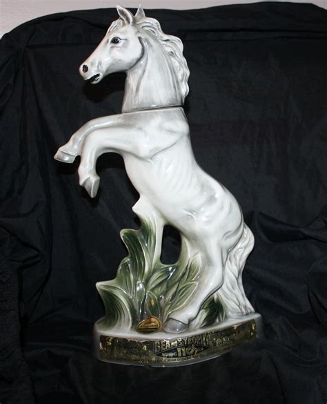 Jim beam horse decanter. Vintage 1962 Jim Beam Horse Trophy Decanter, 13 1/2 inches tall. Genuine Regal China Handcrafted Kentucky Bourbon Straight Whiskey The decanter is empty. No chips or cracks in very good condition From a smoke free home 