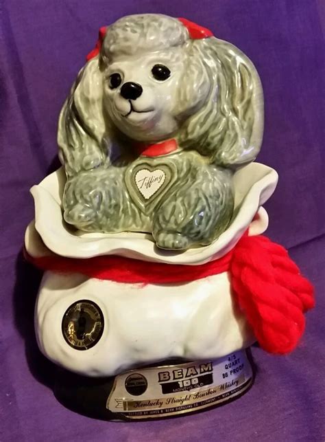 Jim beam poodle decanter. She is the official Mascot of The National Association of Jim Beam Bottle & Specialties Club! She is super adorable and in fantastic shape! This is a really charming collectible. 