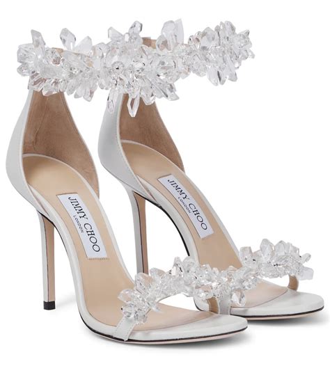 Jimmy choo bridal heels. Made in Italy, a delicate crystal chain suspends a single crystal and gently adorns the ankle like jewellery, while the meticulously crafted crystals also drip gracefully down the line of the heel. Striking and statement, this pointed pair is set on a slim heel. Satin. Crystal chain embellishment. Slim heel. Heel height measures: 100mm/3.9 inches. 