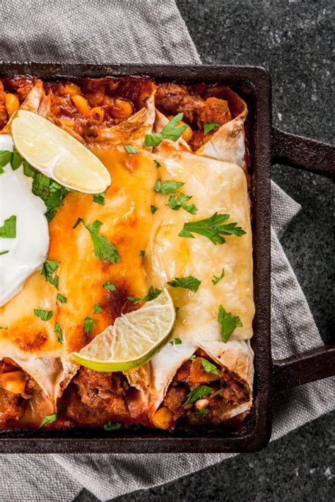 Joanna gaines beef enchiladas. Preheat the oven to 375 degrees F (190 degrees C). Melt butter in a saucepan over medium heat. Add green onions and garlic; cook and stir until fragrant, 2 to 3 minutes. Stir in spinach and cook for 5 minutes. Remove from the heat and mix in 1 cup Monterey Jack, ricotta cheese, and sour cream. Warm one tortilla in a skillet over medium heat ... 