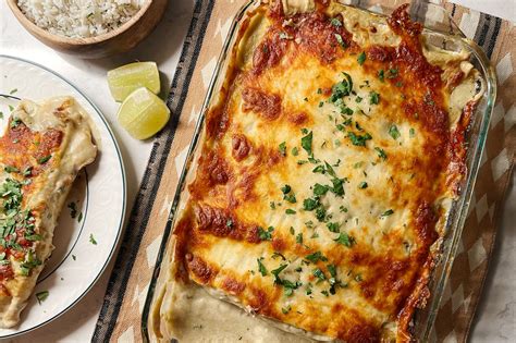 Joanna gaines chicken enchilada. Place one of your oven racks in the top third of your oven and preheat to 350°F. Spray a 13x9x3-in. baking dish with vegetable oil. In a large bowl, whisk together the enchilada sauce, chicken soup and sour cream. Scoop 1/2 cup of sauce into the baking dish. In another bowl, combine the shredded chicken and the can of green chiles. 