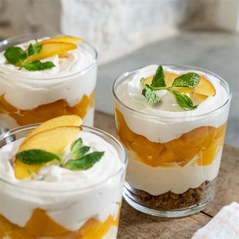 Joanna prepares a peach-themed menu made from peaches she grew on her farm, including a seared pork chop with a side of peach chutney, Brussels sprouts gratin, mini layered biscuits and a peach trifle with spiced whipped cream for dessert.. 