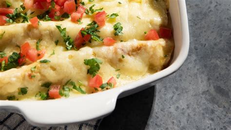 Joanna gaines sour cream enchiladas. 2 (10 ounce) cans mild green enchilada sauce; 10.5 ounce can condensed cream of chicken soup; 8 ounce container sour cream; 1 store-bought rotisserie chicken, shredded (about 4 cups) 