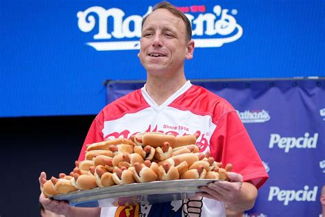 Joey Chestnut eats 75 hot dogs, a world record, at Nathan