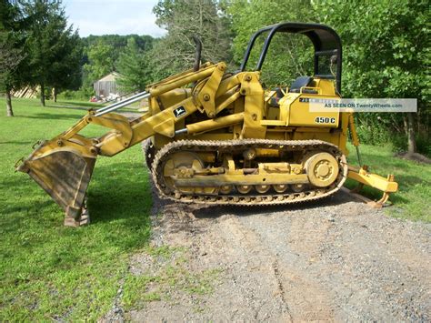 JOHN DEERE 450C Crawler Dozer, adjustment, meeting and disassembly commands, little by little commands, technical specifications, illustrations ... Group 5 - Tracks, Loader ( -216302), Dozer ( -216337) ... Loader (216303- ), Dozer (216338- ) Group 10 - Track Frame Assembly Group 15 - Winch System Group 20 - Winch Fairlead Assembly Group .... 