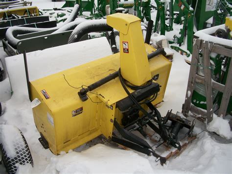 On my John Deere 3046R tractor I show you step by step how to change mower mounting components on my tractor to snowblowing mounting components for a John De.... 