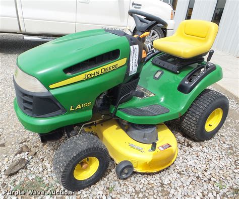 Thiis morning at a yard sale I bought this John Deere lawn tractor. It doesn't run very good, it smokes badly, the mower deck needs repair and a new drive be.... 
