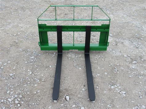 Universal Quick Attach compatible. Add $50 for John Deere Quick Attach hitch. Free shipping within 1,000 miles! Only 185 pounds! 42" pallet forks by EA for small compact tractors with up to 1,250 pounds lift capacity. Universal Quick Attach. Add $50 for John Deere Quick Attach mount.. 