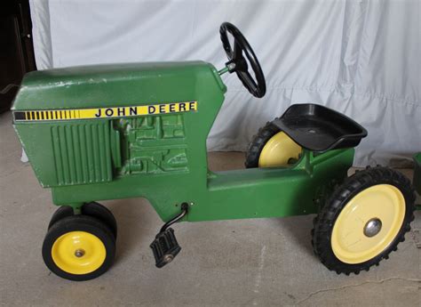 John deere pedal tractor seat. LP81017 - John Deere 4440 Pedal Tractor quantity. Add to cart. description. Features include classic pedal power, adjustable seat, steering and rugged stamped steel and die-cast construction. Rugged steel, die-cast and plastic construction. Wide front steerable front axle. Adjustable seat, wide rear tires. Adult assembly required. 