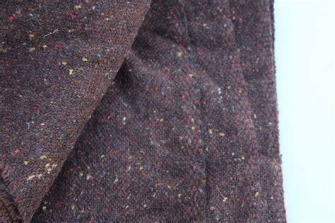Johnson wool.  Slit Pockets.  Made from a wool blend with a tweed fabric...