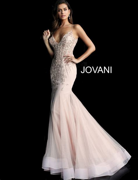 Jovani's - The Jovani 6395 Mint Beaded Illusion Sheath Dress is a stunning and unique choice for a prom night or other special events. The dress is made from illusion beaded tulle, which creates a lightweight and ethereal look. The dress has a form-fitting silhouette and a floor-length skirt, giving it a classic and elegant feel. ...