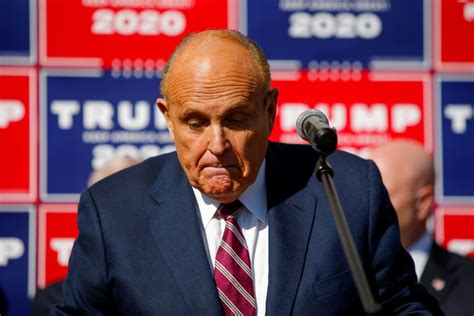 Judge holds Giuliani liable in Georgia election workers’ defamation case and orders him to pay fees